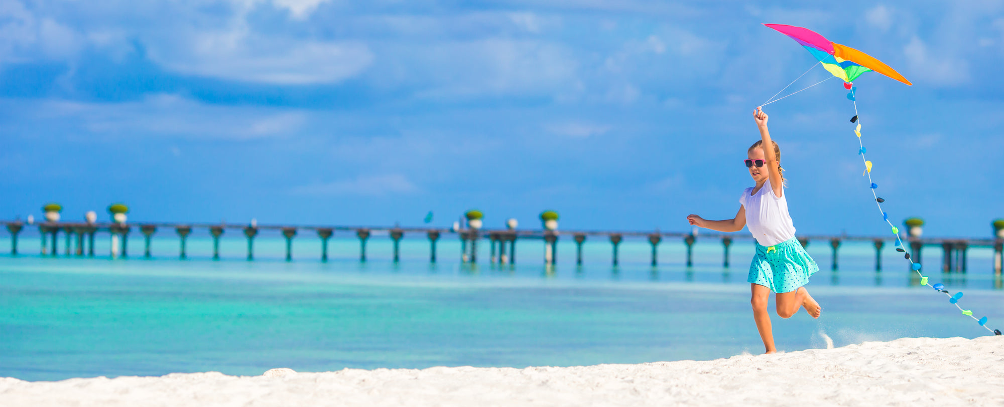 Girl Flying a kite.